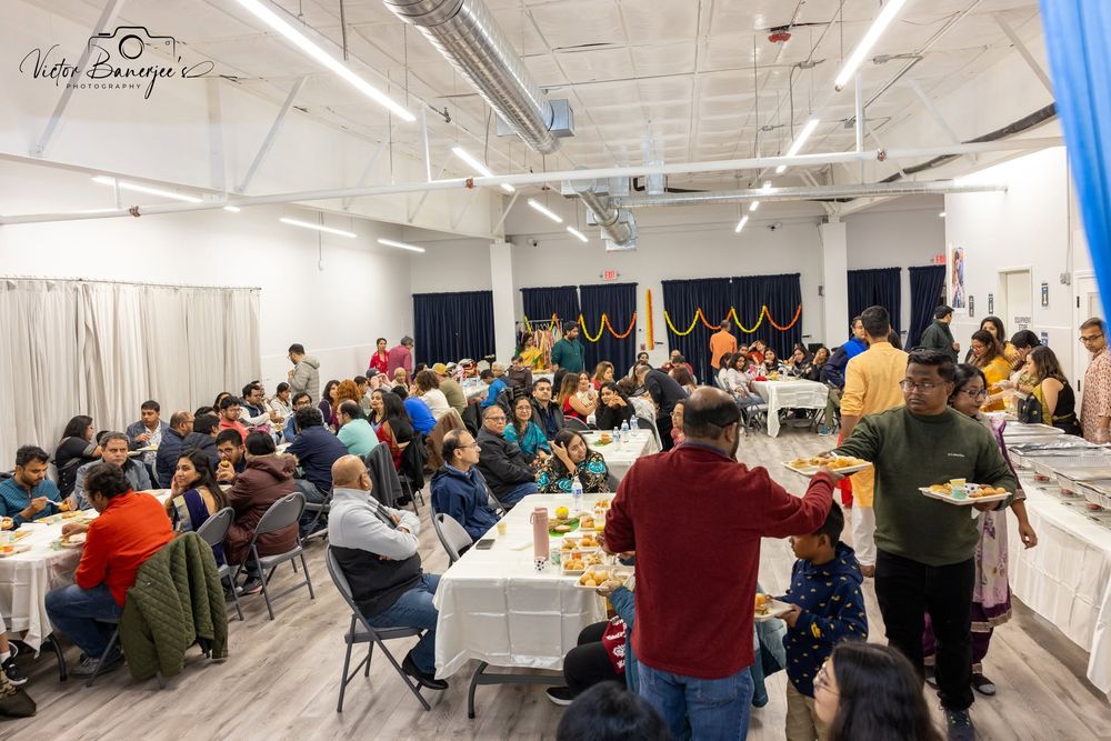 A full hall of guests gathered at an Utsav & Adda community celebration in Houston