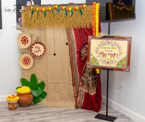 Poush Parbon festival signage and decor at an Utsav & Adda celebration